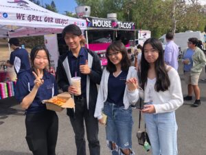student volunteers are taking a break to try the food